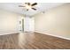 Well-lit bedroom with hardwood flooring, ceiling fan, and attached bath at 8224 Crystal Star Ct, Las Vegas, NV 89145