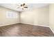 Bedroom boasting natural light, wood floors, and a ceiling fan at 8224 Crystal Star Ct, Las Vegas, NV 89145