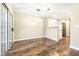 Bright dining room with wood floors, modern lighting, and slider doors at 8224 Crystal Star Ct, Las Vegas, NV 89145