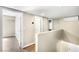 Hallway with multiple doors, neutral walls and wood-look floors at 8224 Crystal Star Ct, Las Vegas, NV 89145