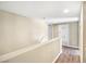 Hallway with hardwood floors, neutral walls, white door and trim at 8224 Crystal Star Ct, Las Vegas, NV 89145