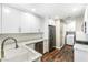 Well-lit kitchen with stainless appliances, granite counters and a classic white cabinets at 8224 Crystal Star Ct, Las Vegas, NV 89145