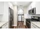 Updated kitchen featuring stainless steel appliances, and bright white cabinetry at 8224 Crystal Star Ct, Las Vegas, NV 89145