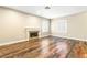 Living room with recessed lighting and arched windows, and a modern fireplace at 8224 Crystal Star Ct, Las Vegas, NV 89145