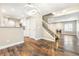 Inviting living room featuring wood floors, modern lighting, and staircase access to upper level at 8224 Crystal Star Ct, Las Vegas, NV 89145