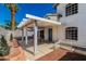 Charming patio with a white pergola and landscaping, perfect for outdoor relaxing at 8224 Crystal Star Ct, Las Vegas, NV 89145