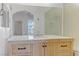 Bathroom vanity with wood cabinets, marble countertop, faucet, and mirror at 8408 Running Deer Ave # 103, Las Vegas, NV 89145