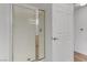 Bathroom featuring a glass shower door and white tiled shower at 8408 Running Deer Ave # 103, Las Vegas, NV 89145