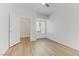 Bedroom with wood floors, natural light, and closet space at 8408 Running Deer Ave # 103, Las Vegas, NV 89145