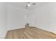 Bedroom with wood flooring, ceiling fan, and access to other rooms at 8408 Running Deer Ave # 103, Las Vegas, NV 89145