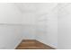 Walk in closet with shelving and wood-look floor at 8408 Running Deer Ave # 103, Las Vegas, NV 89145