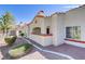 Beautiful single-story home showcasing a red tile roof and mature landscaping at 8408 Running Deer Ave # 103, Las Vegas, NV 89145