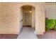 Inviting front entrance with security door and textured stucco exterior at 8408 Running Deer Ave # 103, Las Vegas, NV 89145