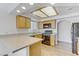 Well-lit kitchen with stainless steel appliances and a breakfast bar at 8408 Running Deer Ave # 103, Las Vegas, NV 89145