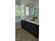Bright bathroom features a tub, large vanity with dark cabinets, and a glass-enclosed shower at 9008 Cotton Rose Way, Las Vegas, NV 89134