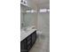 Bathroom featuring updated vanity with sink, mirror, and bathtub with shower at 9008 Cotton Rose Way, Las Vegas, NV 89134