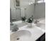 Bathroom features double sinks, white countertops, and chrome fixtures at 9008 Cotton Rose Way, Las Vegas, NV 89134
