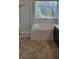Bright bathroom featuring a tub, tiled shower, and window bringing natural light into the space at 9008 Cotton Rose Way, Las Vegas, NV 89134