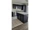 Updated kitchen featuring black cabinets, stainless steel appliances, and white countertops at 9008 Cotton Rose Way, Las Vegas, NV 89134