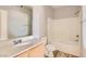 Clean bathroom featuring a tub and shower combo, vanity with sink, and toilet at 9580 W Reno Ave # 211, Las Vegas, NV 89148