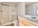 Bright bathroom featuring a vanity, toilet, and shower with glass doors at 9580 W Reno Ave # 211, Las Vegas, NV 89148