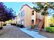 The exterior of this home is a two-story condo with desert landscaping and a private staircase at 9580 W Reno Ave # 211, Las Vegas, NV 89148