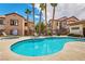 Resort-style pool and spa area with palm trees and lounge chairs at 9580 W Reno Ave # 211, Las Vegas, NV 89148
