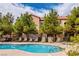 Community pool featuring lounge chairs for residents to enjoy poolside at 9580 W Reno Ave # 211, Las Vegas, NV 89148