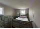 Bedroom showcasing a charming bed, grey dresser, and delightful LED lighting at 961 Spiracle Ave, Henderson, NV 89002