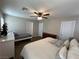 Large bedroom featuring a ceiling fan, a bed, and a small daybed at 961 Spiracle Ave, Henderson, NV 89002