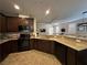 Open-concept kitchen featuring granite countertops and stainless steel appliances at 961 Spiracle Ave, Henderson, NV 89002