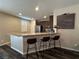 Kitchen featuring a breakfast bar with granite counters and seating for three at 961 Spiracle Ave, Henderson, NV 89002