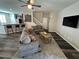 Comfortable living room with couches, rug, and a breakfast bar and open access to stairs at 961 Spiracle Ave, Henderson, NV 89002