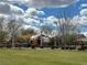 Community playground with shade canopy on a grassy area with trees and landscaping, creating a Gathering-friendly outdoor space at 961 Spiracle Ave, Henderson, NV 89002