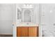 Bright bathroom featuring a vanity with marble countertop and a large mirror, offering ample space and storage at 11298 Merado Peak Dr, Las Vegas, NV 89135
