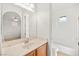 Bathroom with a marbled sink counter, and a combined toilet and shower at 11298 Merado Peak Dr, Las Vegas, NV 89135