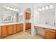 Bathroom featuring double sinks, makeup counter, and walk-in shower at 11298 Merado Peak Dr, Las Vegas, NV 89135
