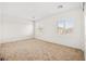 Bright neutral-toned bedroom with carpeted floors and shuttered windows at 11298 Merado Peak Dr, Las Vegas, NV 89135