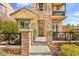 Inviting two-story townhouse with stone accents, a pergola, and manicured landscaping at 11298 Merado Peak Dr, Las Vegas, NV 89135