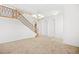 Bright, open foyer with a staircase, chandelier, neutral carpet, and white walls at 11298 Merado Peak Dr, Las Vegas, NV 89135