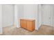 Hallway view featuring a built in wooden cabinet and access to other rooms at 11298 Merado Peak Dr, Las Vegas, NV 89135