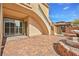 Paver patio with fountain and staircase to second level balcony in a luxury community at 11298 Merado Peak Dr, Las Vegas, NV 89135
