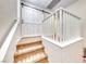 Carpeted staircase with white railing leading to the upper level and featuring a rustic barn door at 1140 Paradise Vista Dr, Henderson, NV 89002