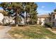 Residential buildings with lawns and mature trees on a sunny day at 1405 S Nellis Blvd # 2087, Las Vegas, NV 89104