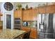 Spacious kitchen features granite countertops, stainless steel appliances, and custom cabinets at 1516 Barrington Oaks St, North Las Vegas, NV 89084