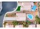Bird's-eye view showcasing backyard pools and well-maintained landscaping in a residential neighborhood at 1516 Dusty Canyon St, Henderson, NV 89052