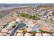 Expansive aerial view of a residential neighborhood featuring desert landscaping and private pools at 1516 Dusty Canyon St, Henderson, NV 89052