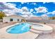 Backyard pool with integrated hot tub, desert landscaping and generous space to entertain at 1516 Dusty Canyon St, Henderson, NV 89052