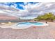 Sparkling backyard pool with built-in spa, desert landscaping, and clear blue water for outdoor enjoyment at 1516 Dusty Canyon St, Henderson, NV 89052