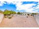 Expansive backyard featuring a refreshing pool, desert landscaping, and ample space for outdoor activities at 1516 Dusty Canyon St, Henderson, NV 89052